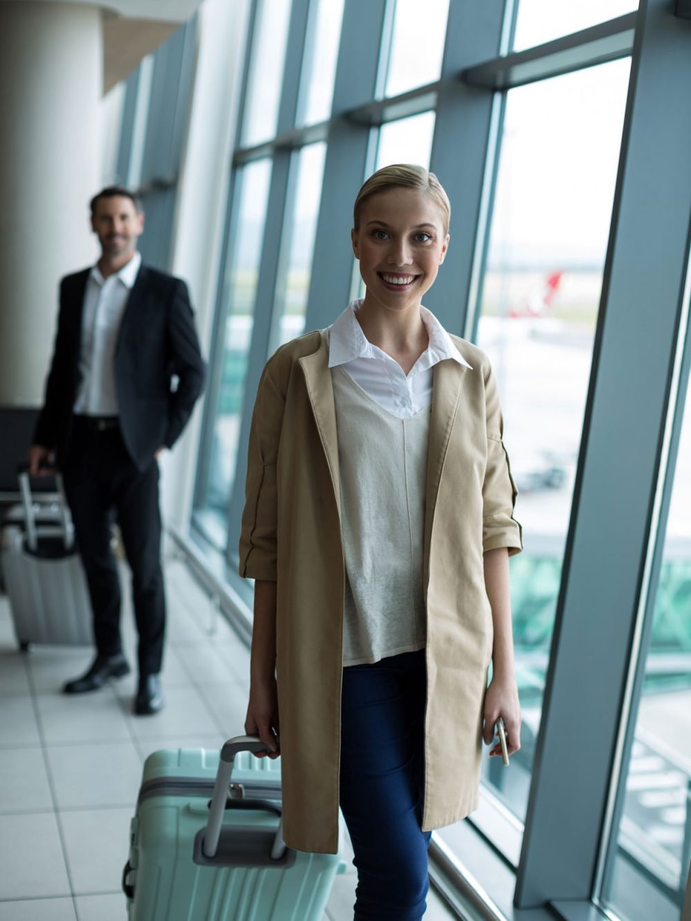 businesspeople-with-luggage-airport.jpg