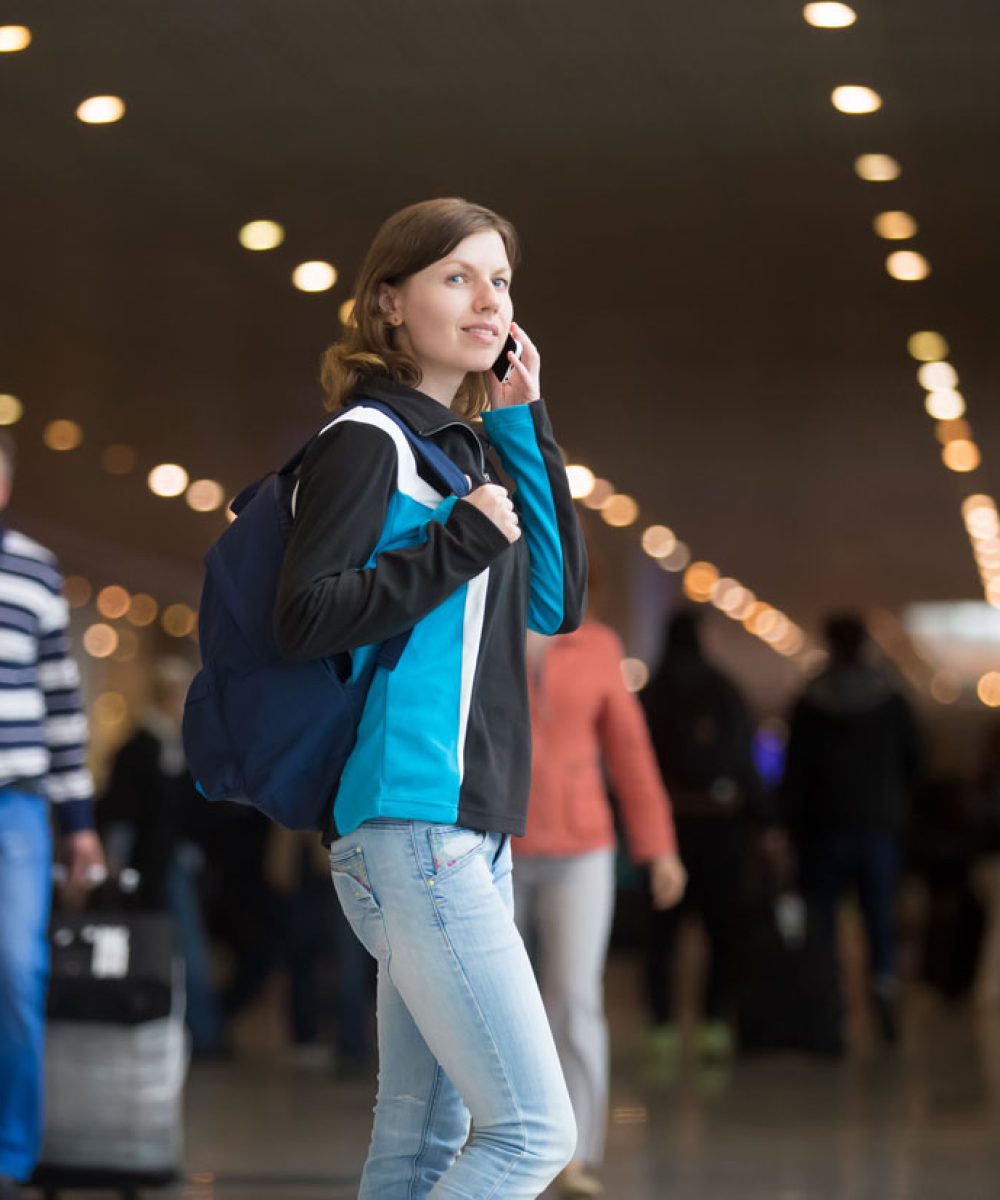 girl-making-call-airport.jpg